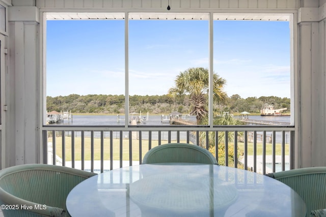 57 Craven St, Ocean Isle Beach, NC 28469 - sunroom / solarium featuring a water view