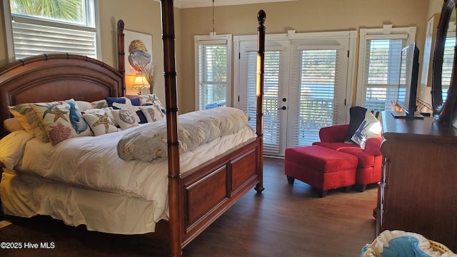 57 Craven St, Ocean Isle Beach, NC 28469 - bedroom featuring access to exterior, dark wood finished floors, multiple windows, and ornamental molding