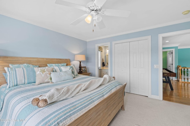 57 Craven St, Ocean Isle Beach, NC 28469 - bedroom featuring ornamental molding, a closet, a ceiling fan, and light carpet