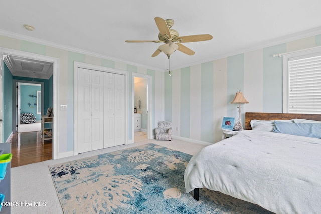 57 Craven St, Ocean Isle Beach, NC 28469 - carpeted bedroom featuring attic access, ornamental molding, a ceiling fan, and a closet