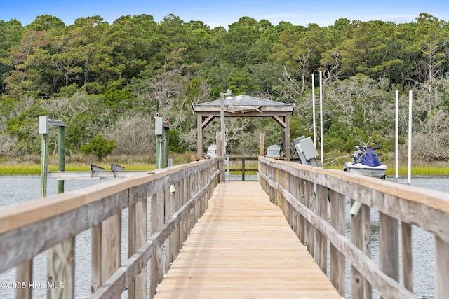 57 Craven St, Ocean Isle Beach, NC 28469 - dock area with a gazebo, a water view, and a forest view