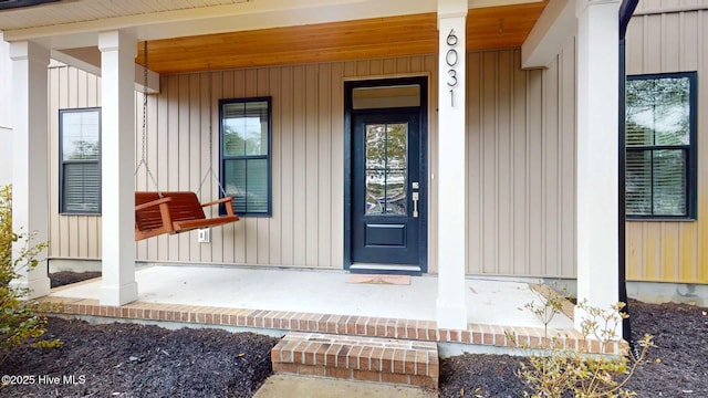 entrance to property featuring covered porch