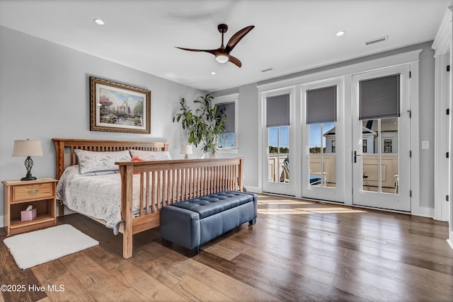 bedroom with hardwood / wood-style flooring, ceiling fan, and access to outside