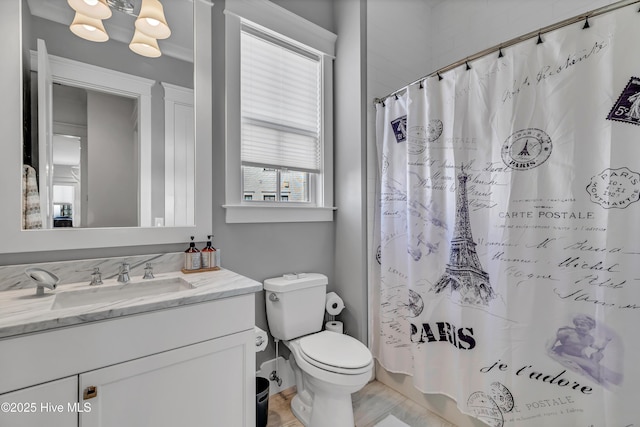 bathroom featuring vanity, toilet, and a shower with shower curtain