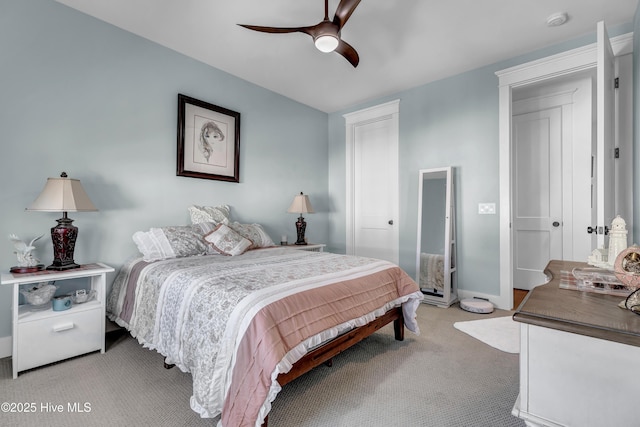 bedroom with ceiling fan and light colored carpet