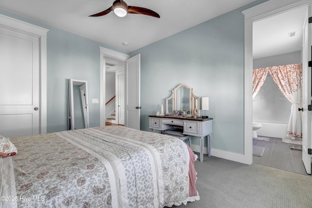 carpeted bedroom featuring ceiling fan and connected bathroom