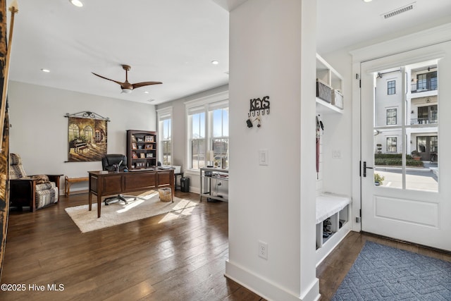 interior space with dark hardwood / wood-style floors and ceiling fan