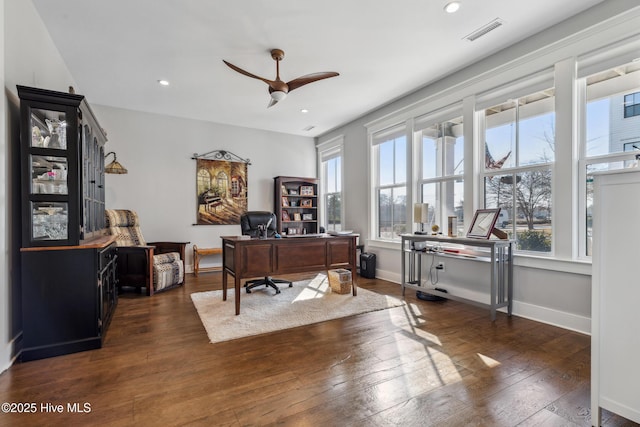 home office featuring dark wood-type flooring and ceiling fan