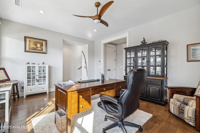 home office featuring ceiling fan and dark hardwood / wood-style flooring