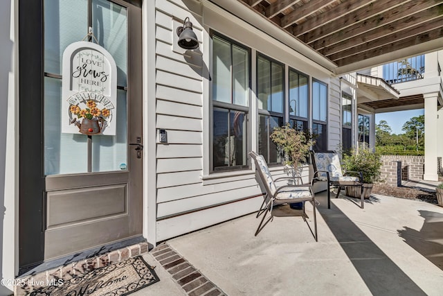 doorway to property featuring a porch