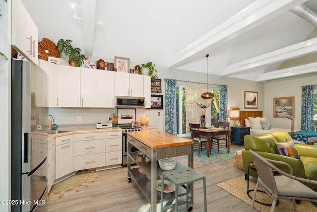 530 Contentnea Ave, New Bern, NC 28560 - kitchen with appliances with stainless steel finishes, butcher block counters, open shelves, open floor plan, and a sink