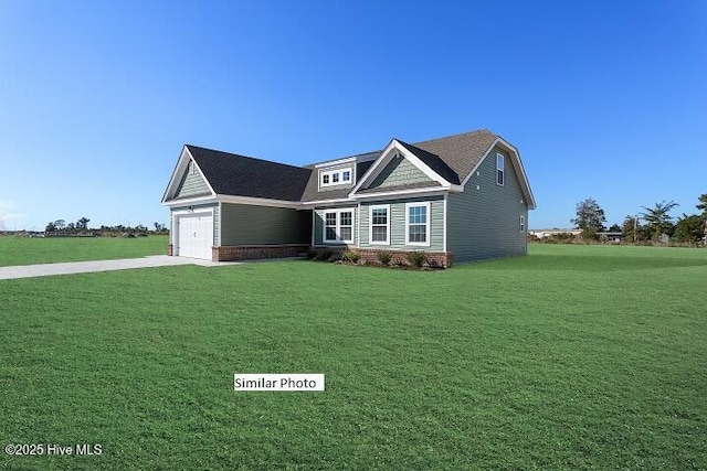 craftsman-style home featuring a garage and a front lawn