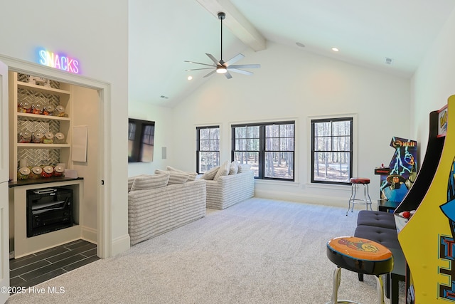 interior space featuring plenty of natural light, high vaulted ceiling, dark carpet, and beam ceiling