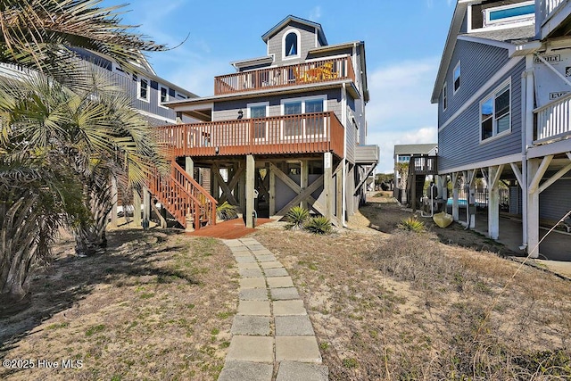 rear view of house featuring a balcony