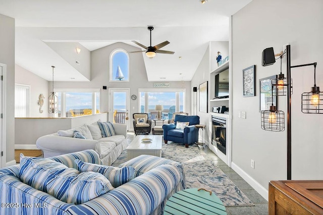 living room featuring high vaulted ceiling and ceiling fan