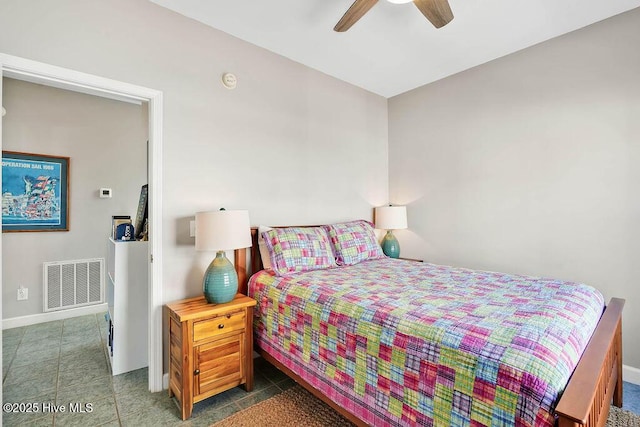 tiled bedroom with ceiling fan