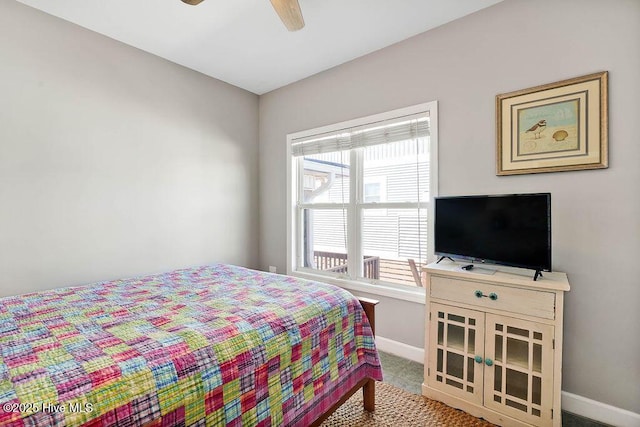 carpeted bedroom featuring ceiling fan