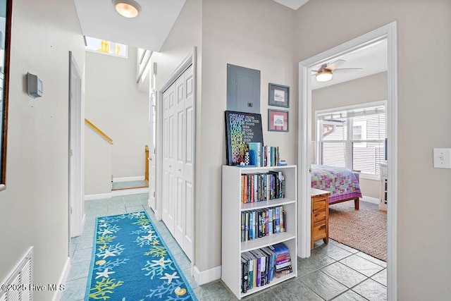 hall with tile patterned flooring