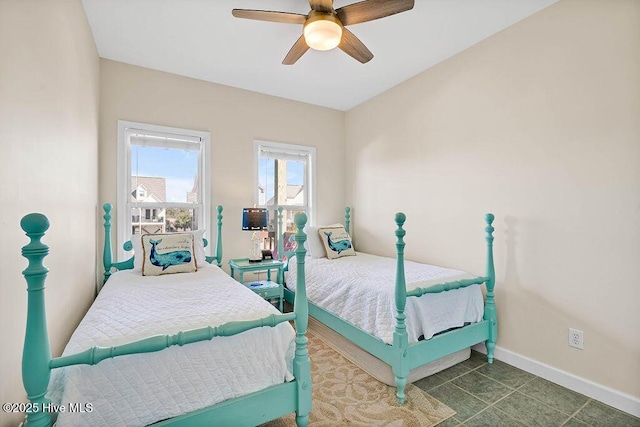 tiled bedroom with ceiling fan