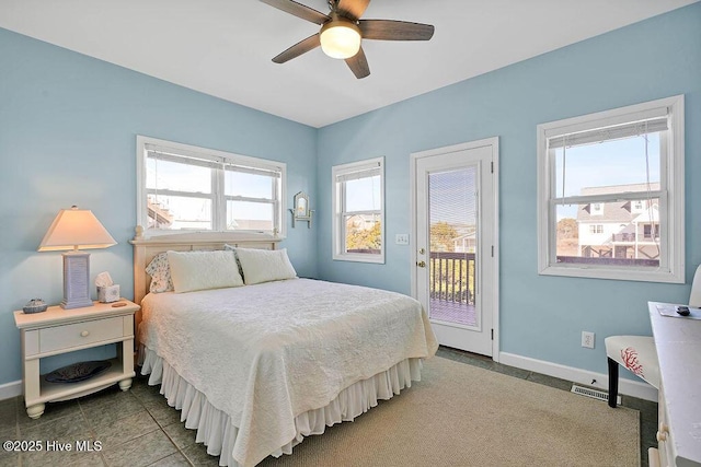 bedroom featuring ceiling fan, access to exterior, and tile patterned floors