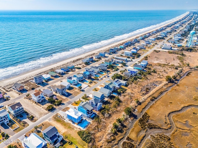 aerial view featuring a water view and a view of the beach