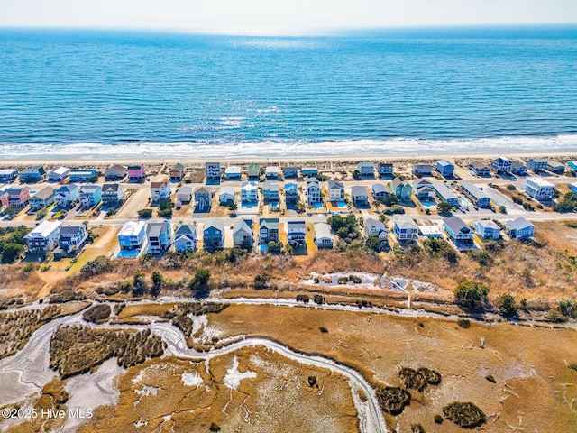 aerial view with a water view and a view of the beach