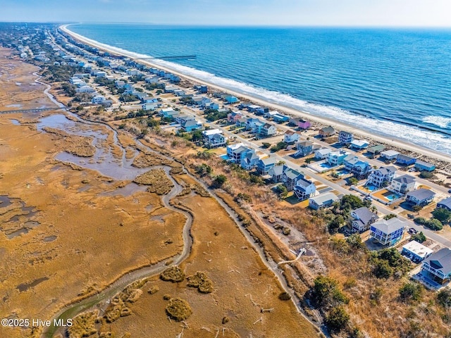 bird's eye view featuring a water view and a view of the beach