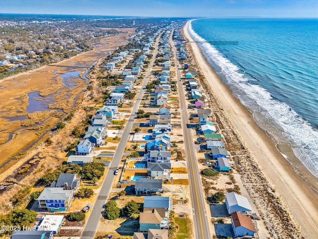 aerial view featuring a water view and a view of the beach