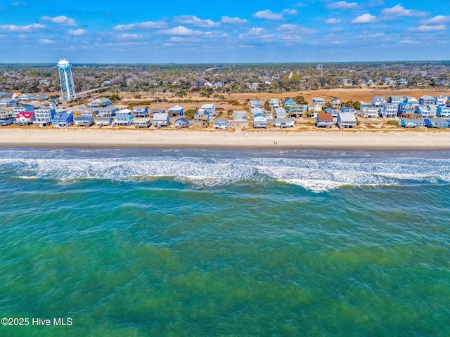 bird's eye view featuring a water view and a view of the beach