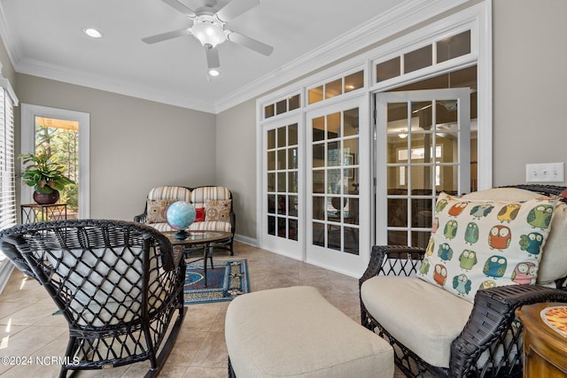 sitting room featuring ceiling fan, ornamental molding, and light tile patterned floors