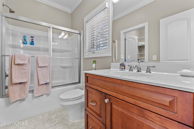 full bathroom featuring tile patterned floors, toilet, crown molding, vanity, and enclosed tub / shower combo