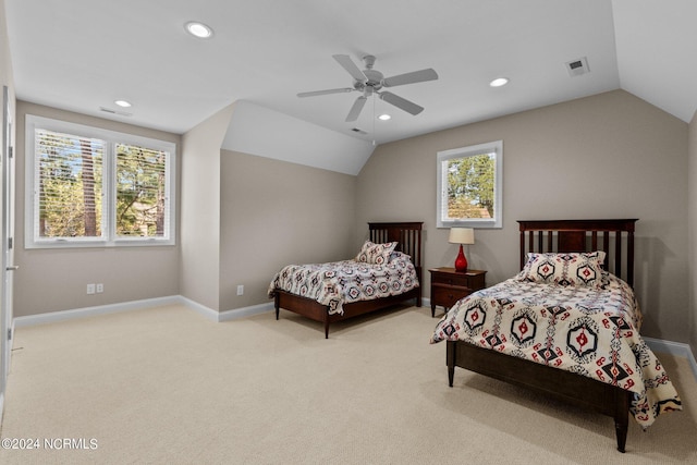 carpeted bedroom with ceiling fan, lofted ceiling, and multiple windows