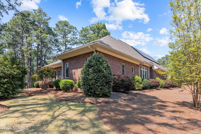 view of property exterior featuring a yard