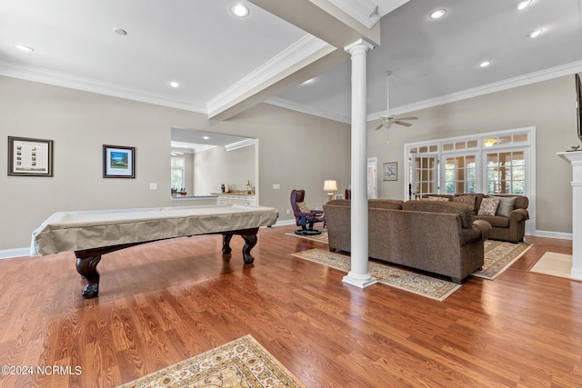 recreation room with ornate columns, crown molding, light hardwood / wood-style flooring, and a wealth of natural light