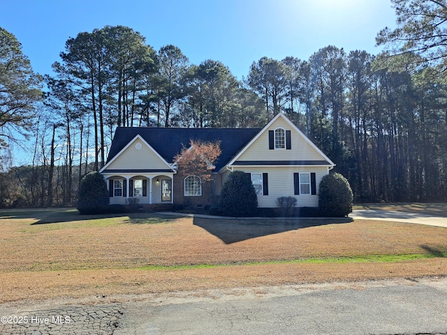 view of front of house featuring a front yard and covered porch