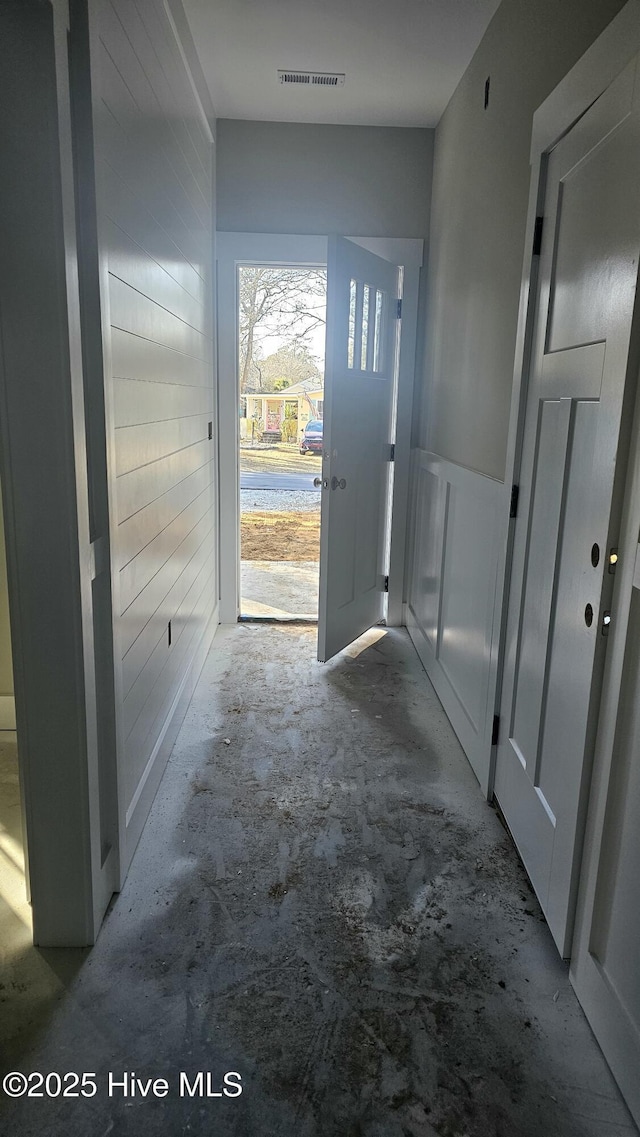 corridor with concrete flooring