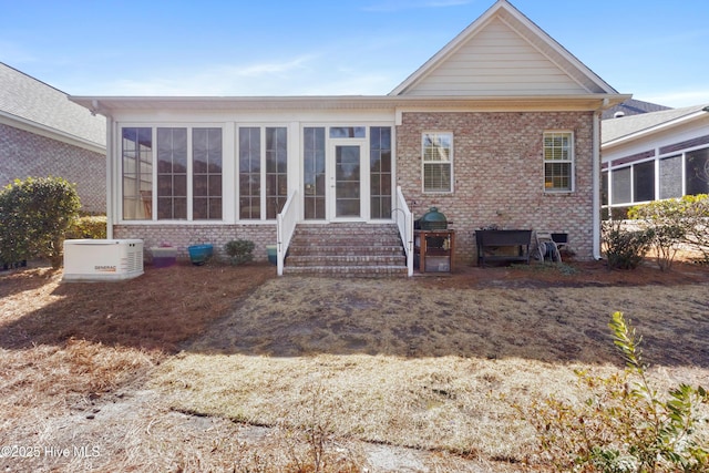 back of property featuring a sunroom