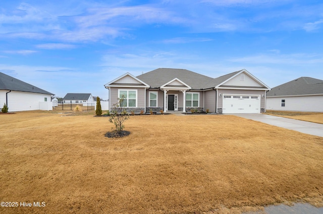 view of front of property with a garage and a front lawn