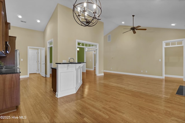 kitchen with light wood-style floors, visible vents, stainless steel appliances, and a sink