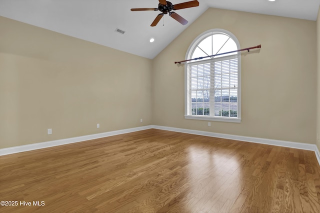 unfurnished room featuring a healthy amount of sunlight, light wood-style floors, baseboards, and visible vents