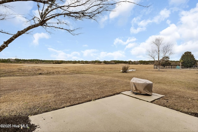 view of yard with a rural view