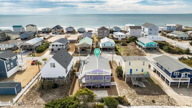 drone / aerial view featuring a residential view and a water view