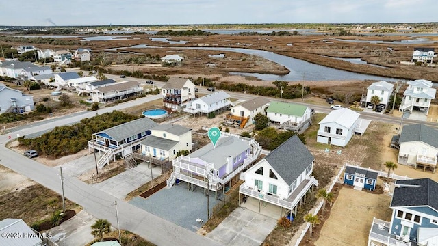 aerial view with a water view and a residential view