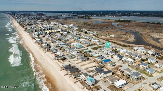 birds eye view of property featuring a water view and a view of the beach