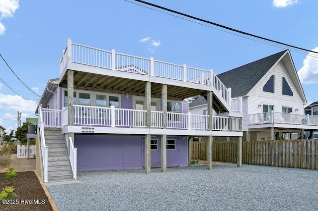 beach home with stairs and fence