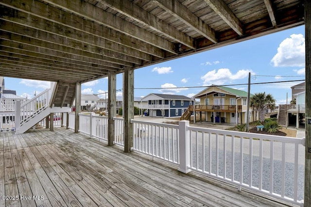 wooden terrace with a residential view and stairway