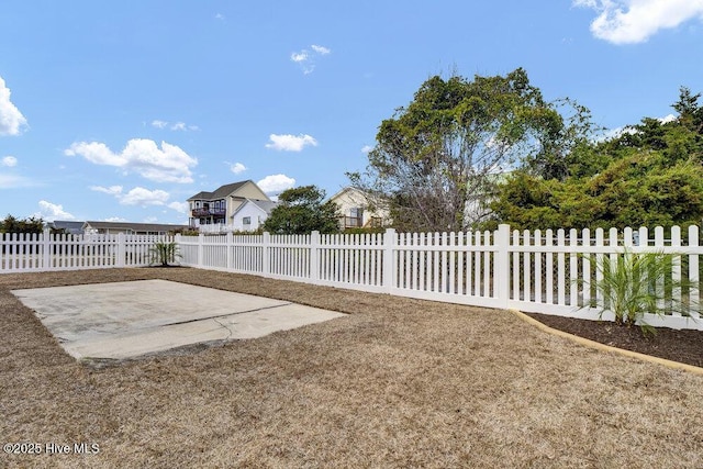 view of yard featuring a fenced front yard and a patio area