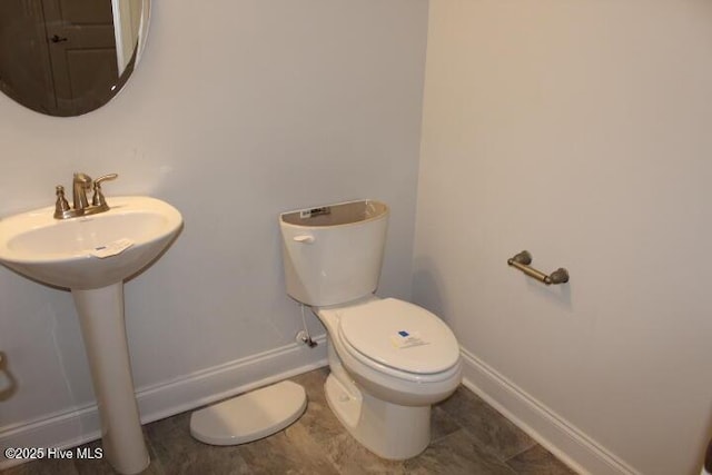 bathroom with sink and toilet