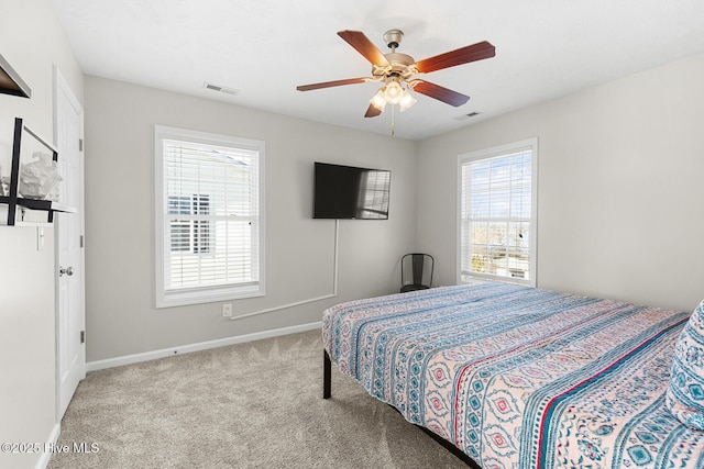 bedroom with light carpet and ceiling fan