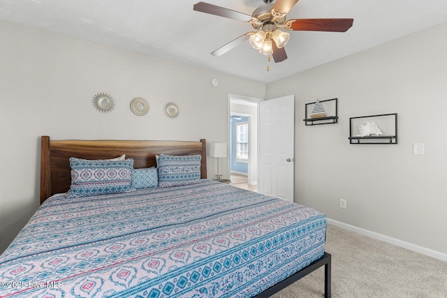 bedroom with ceiling fan and carpet